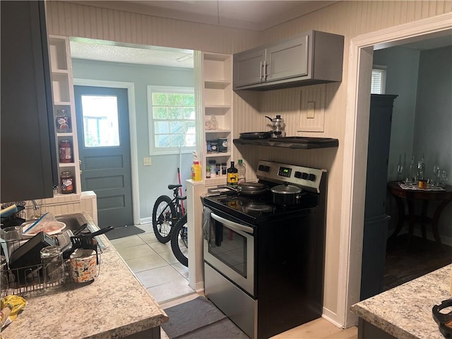 3228 Reynolds St, Brunswick, GA 31520 - kitchen featuring stainless steel electric stove, light countertops, gray cabinets, and light tile patterned floors