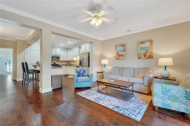 living room with ceiling fan, dark hardwood / wood-style floors, and ornamental molding