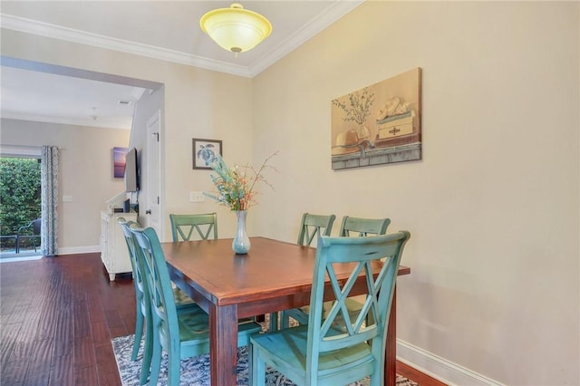 dining space with dark hardwood / wood-style floors and ornamental molding