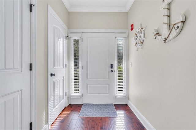 entrance foyer featuring dark hardwood / wood-style floors and ornamental molding