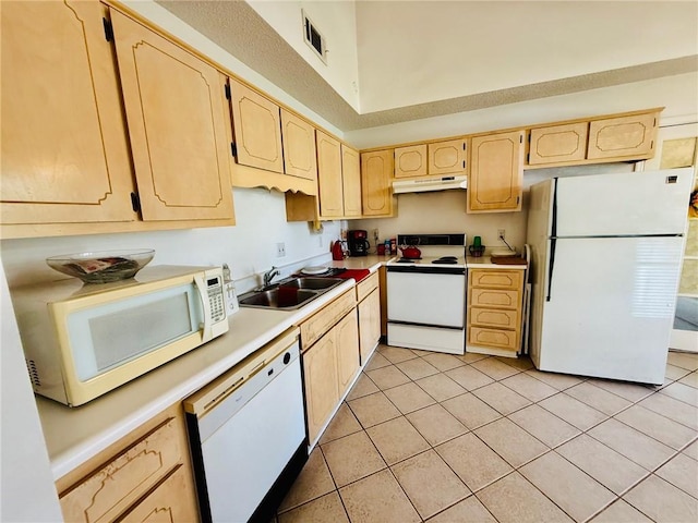 373 Terrapin Trl, Brunswick, GA 31525 - kitchen with white appliances, under cabinet range hood, light brown cabinetry, a sink, and light countertops