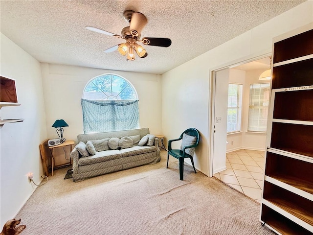 373 Terrapin Trl, Brunswick, GA 31525 - sitting room with carpet, a ceiling fan, a textured ceiling, and tile patterned flooring