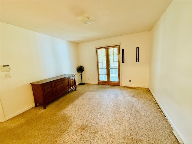 373 Terrapin Trl, Brunswick, GA 31525 - empty room featuring french doors, baseboards, and carpet floors