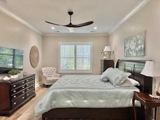 bedroom with ceiling fan, ornamental molding, and light hardwood / wood-style flooring