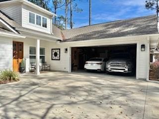 view of side of home with a garage