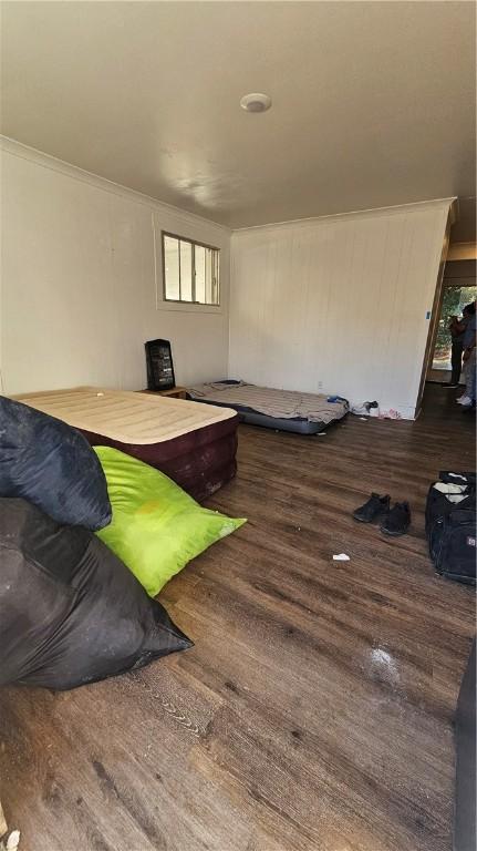 bedroom with wood finished floors