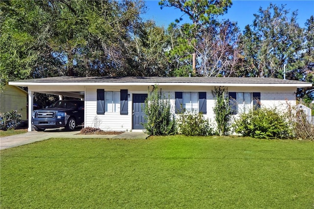 single story home with a carport, a front lawn, and concrete driveway