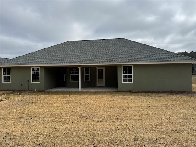 rear view of house featuring a patio