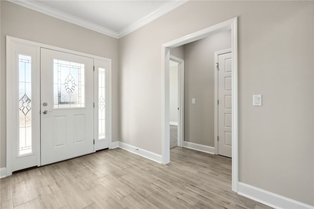 entrance foyer featuring light hardwood / wood-style floors and crown molding