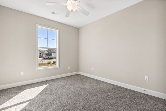 unfurnished room featuring ceiling fan and carpet floors