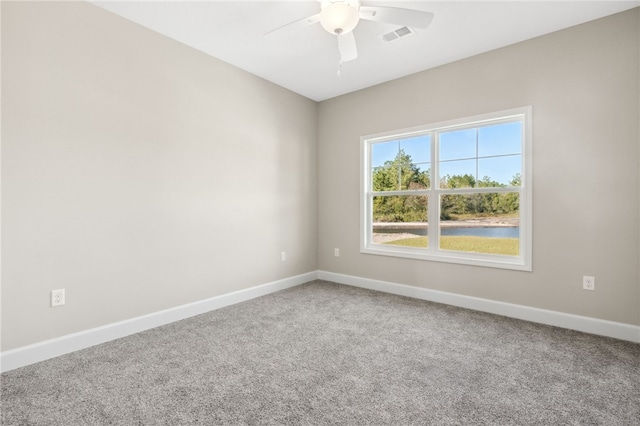 carpeted empty room with ceiling fan