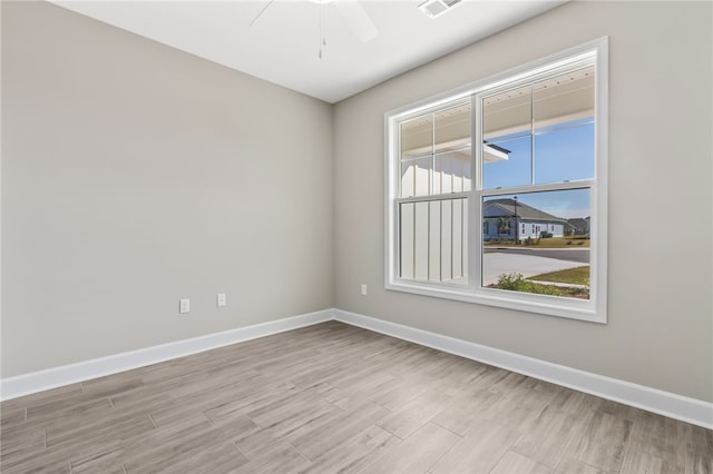 unfurnished room with light hardwood / wood-style floors and ceiling fan