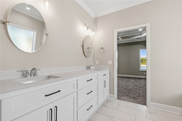 bathroom with crown molding and vanity