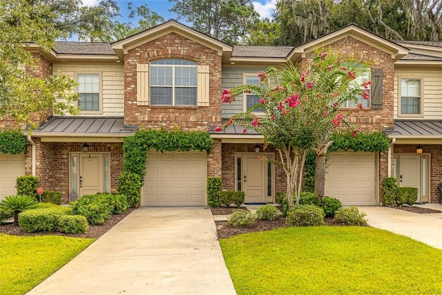 view of property with a front yard and a garage