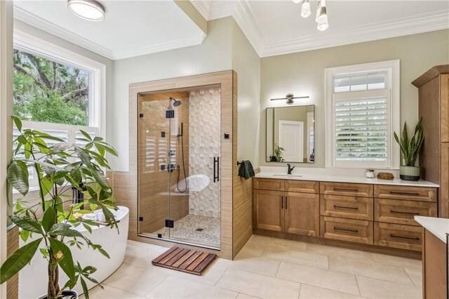 1232 Riverpoint Ln NE, Townsend, GA 31331 - bathroom with vanity, a shower stall, a freestanding bath, tile patterned floors, and ornamental molding