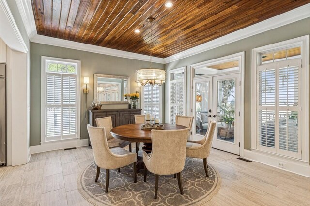 1232 Riverpoint Ln NE, Townsend, GA 31331 - dining space featuring wood ceiling, french doors, a chandelier, light wood-type flooring, and ornamental molding