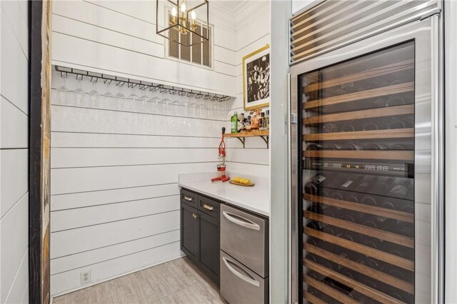 1232 Riverpoint Ln NE, Townsend, GA 31331 - bar area featuring beverage cooler, a chandelier, dishwasher, and wooden walls