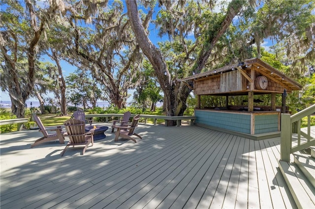 1232 Riverpoint Ln NE, Townsend, GA 31331 - wooden terrace featuring an outdoor fire pit