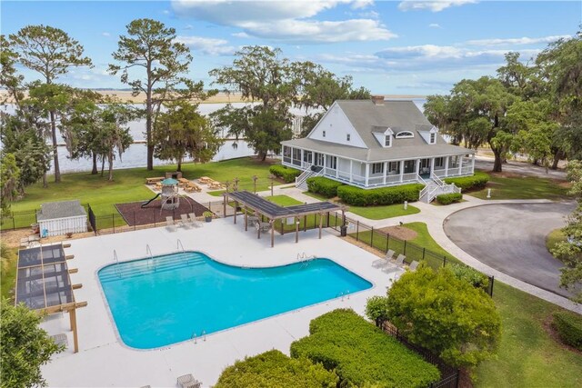 1232 Riverpoint Ln NE, Townsend, GA 31331 - community pool featuring a patio area and a water view