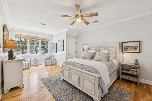 1232 Riverpoint Ln NE, Townsend, GA 31331 - bedroom with ornamental molding, baseboards, light wood-type flooring, a ceiling fan, and recessed lighting