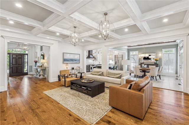 1232 Riverpoint Ln NE, Townsend, GA 31331 - living room with a chandelier, coffered ceiling, beamed ceiling, baseboards, and wood finished floors