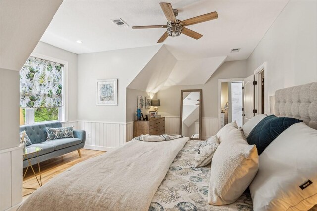 1232 Riverpoint Ln NE, Townsend, GA 31331 - bedroom featuring wood finished floors, a wainscoted wall, and ceiling fan