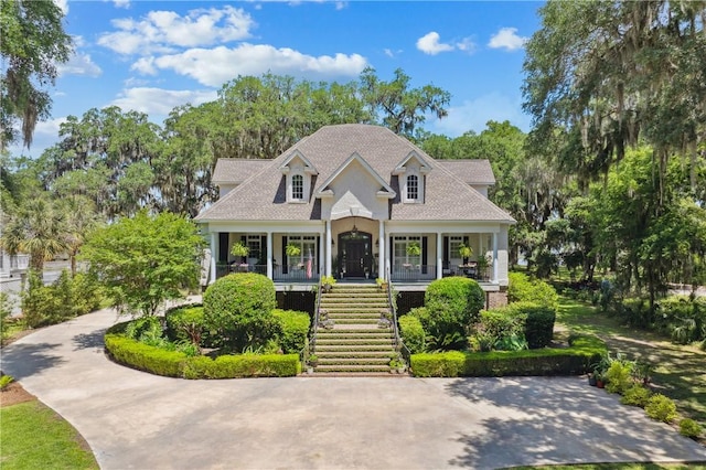 1232 Riverpoint Ln NE, Townsend, GA 31331 - view of front facade with a porch and stairway
