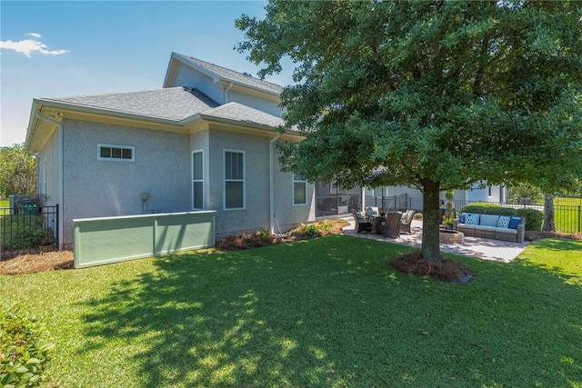 back of house featuring an outdoor hangout area, a patio, and stucco siding