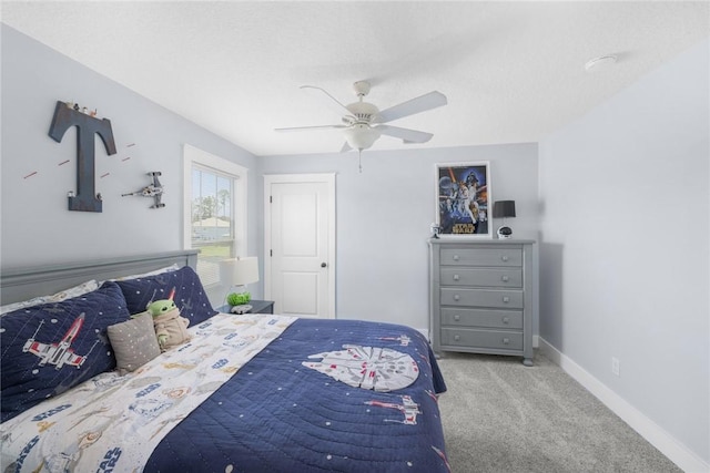 bedroom with carpet flooring, baseboards, and ceiling fan