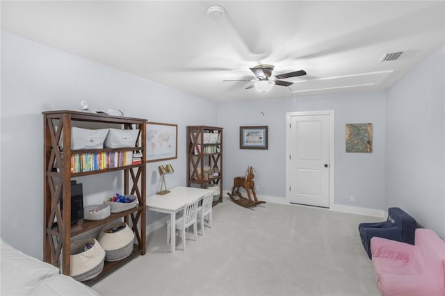 office area with attic access, ceiling fan, carpet, and baseboards