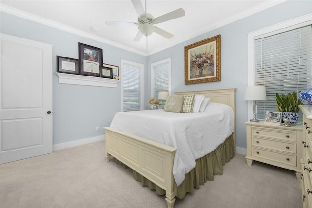 bedroom featuring light carpet, baseboards, ornamental molding, and a ceiling fan