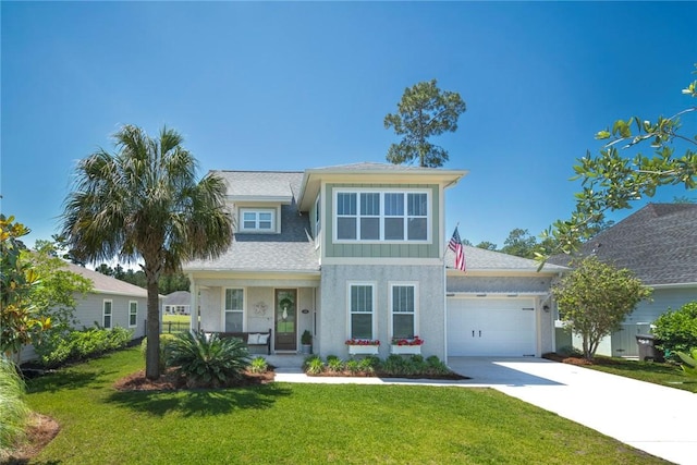 view of front of home featuring a garage, driveway, a front lawn, covered porch, and a shingled roof