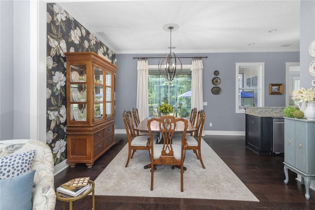 dining room with a chandelier, baseboards, dark wood finished floors, and crown molding