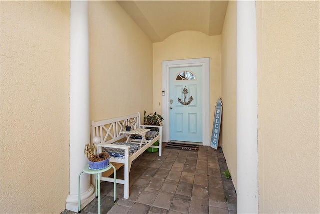 property entrance featuring stucco siding