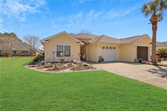 ranch-style home with stucco siding, a front lawn, decorative driveway, and a garage