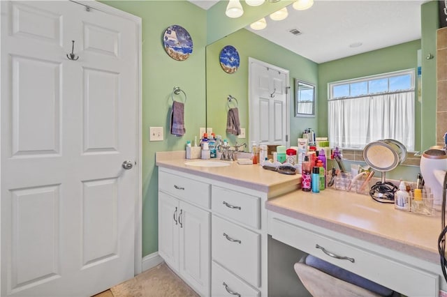 bathroom with visible vents and vanity