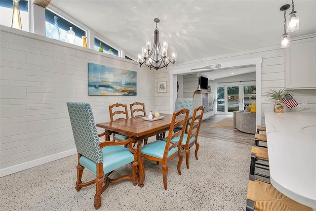 dining space featuring a chandelier