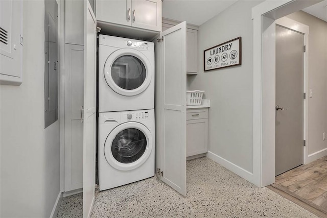 washroom with stacked washer / drying machine