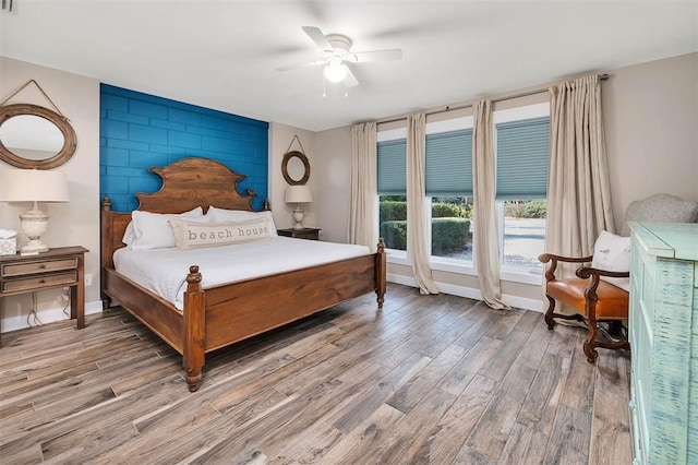 bedroom featuring ceiling fan and wood-type flooring