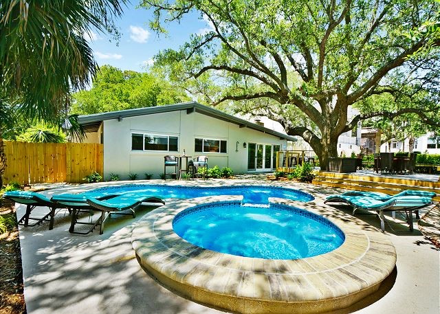 view of swimming pool featuring an in ground hot tub and a patio