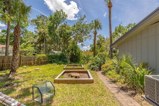 136 Belle Point Pkwy, Brunswick, GA 31525 - view of yard with a vegetable garden and central AC