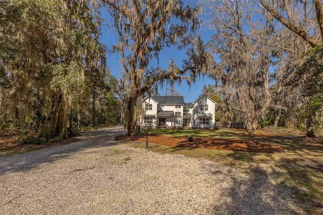 view of front of home with a front yard and driveway