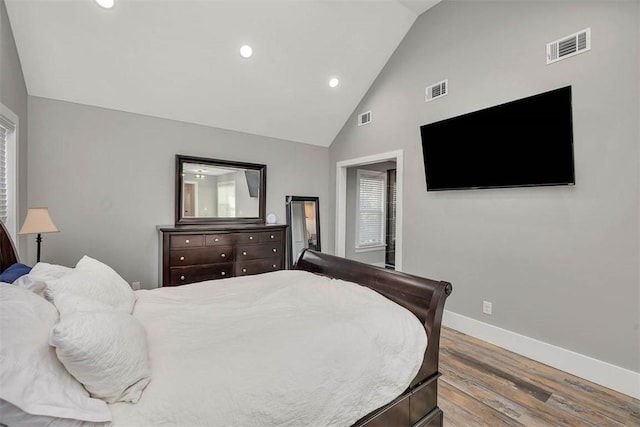 bedroom featuring recessed lighting, visible vents, baseboards, and wood finished floors