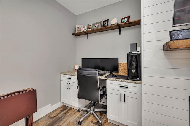 home office with wood finished floors and baseboards