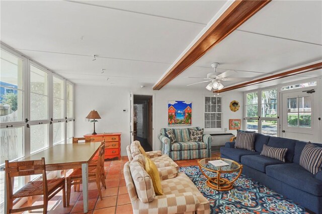 living room featuring beamed ceiling, french doors, light tile patterned floors, and ceiling fan