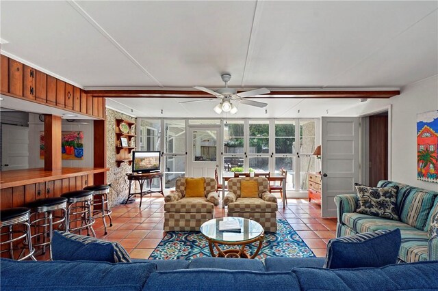 living room with ceiling fan, light tile patterned floors, and french doors