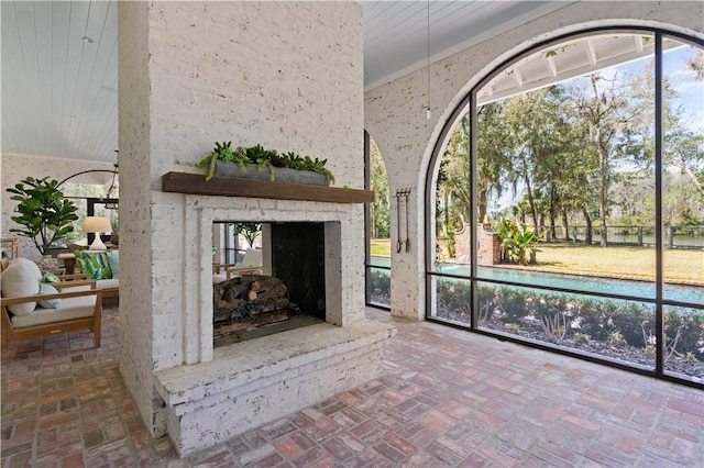 interior space with a fireplace and wood ceiling