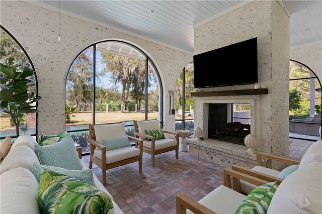 view of patio / terrace featuring an outdoor living space with a fireplace