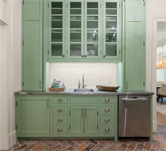 bar with dishwasher, green cabinets, sink, and tasteful backsplash