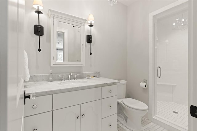 bathroom with tile patterned flooring, toilet, an enclosed shower, and vanity